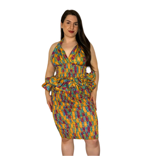 A model wearing a multicolor halter neck top and shirred skirt.
